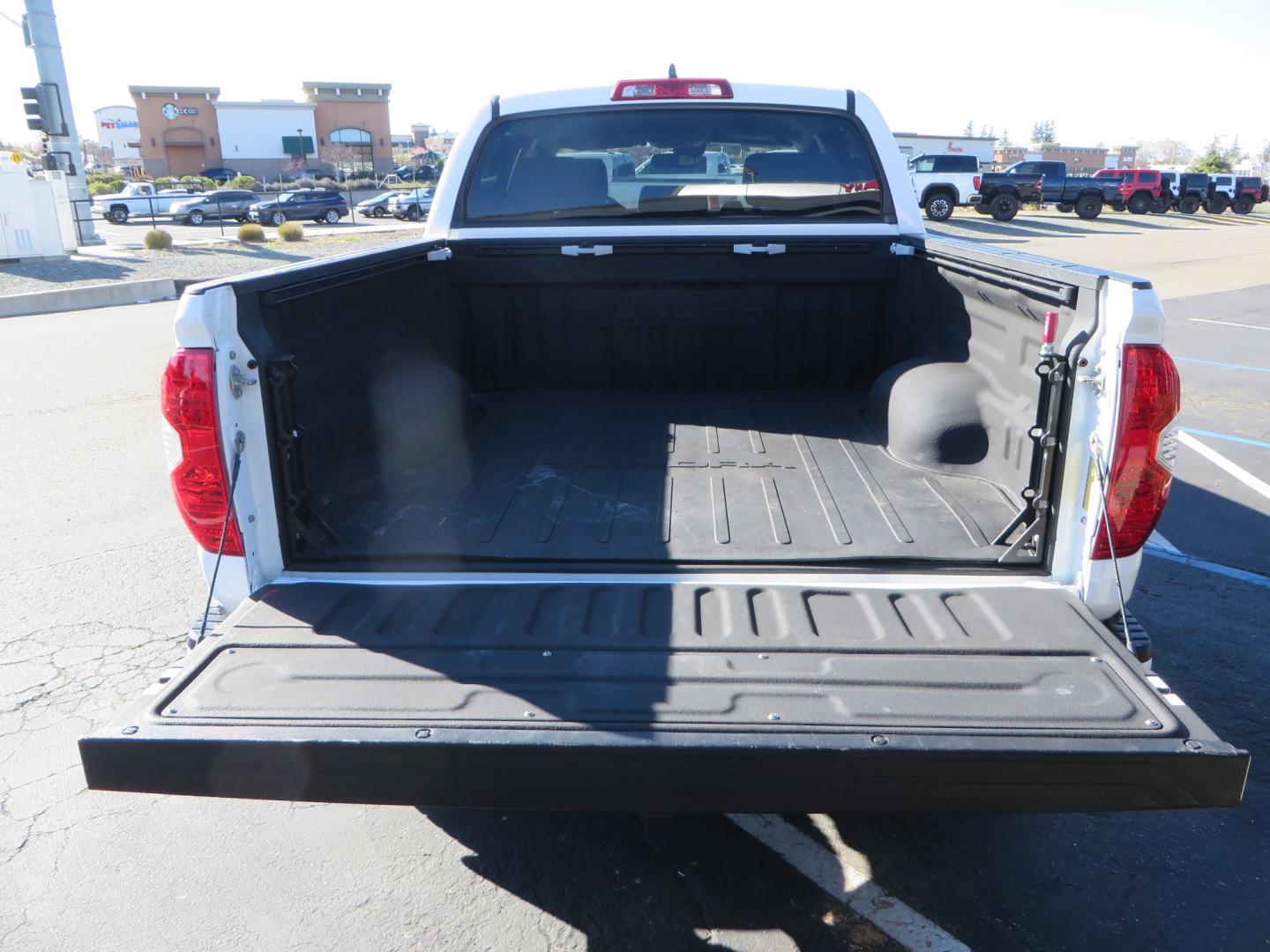 2020 White /GREY Toyota Tundra SR5 (5TFDY5F19LX) with an 5.7L engine, automatic transmission, located at 2630 Grass Valley Highway, Auburn, CA, 95603, (530) 508-5100, 38.937893, -121.095482 - Features - King Off Road adjustable remote reservoir coil overs, King 2.5 adjustable remote reservoir rear shocks, Method Race wheels, Falken Wildpeak tires, Sliders, Bed braces, Borla Exhaust, Husky floor mats, Window tint, and Ram phone mounts. - Photo#13